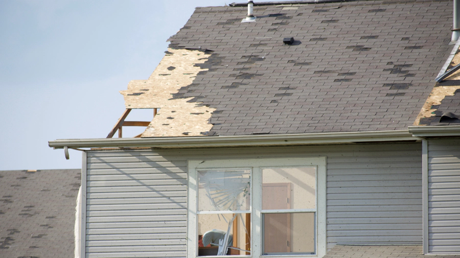 damaged roof in a house after a storm blue springs mo